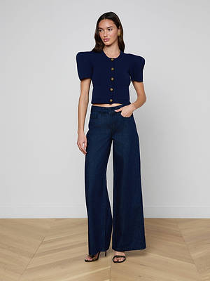 A woman wearing the Pacey Wide-Leg Jean in dark wash and a short-sleeved shirt.