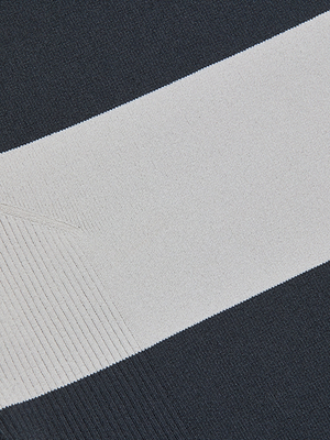 Close-up of the Rosemond Bodysuit's power stretch knit fabric, featuring a wide white horizontal stripe bordered by dark navy blue. The ribbed texture and weave are clearly visible.