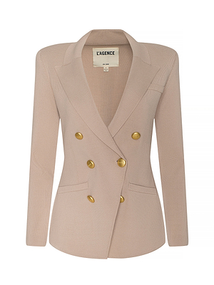 The Amelia Knit Blazer is a light beige double-breasted blazer in a structured knit, featuring gold buttons, two front pockets, peaked lapels, and a LAGENCE label inside the collar.