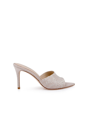 The Lolita Linen Open-Toe Mule in beige features a stiletto heel, open toe, and delicate white floral embroidery on the linen upper, shown against a plain white background.