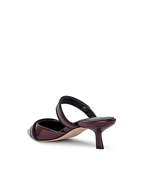 The Gilliane Heeled Mule by L'AGENCE, a wine patent leather mule with a pointed toe, black trim, and low kitten heel, showcases vintage contemporary style on a white background.