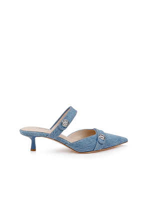 The Gilliane Denim Mule is a modern pointed-toe mule with a low kitten heel, two straps each topped with a round silver button, and a memory foam insole for extra comfort.