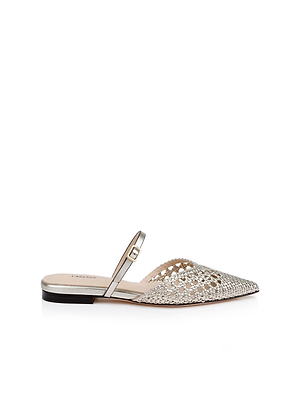 The Jacklyn Leather Flat Mule is a women's pointed-toe flat in gold leather with a woven upper, open back, thin buckle strap over the instep, and a low black heel, shown on a white background.