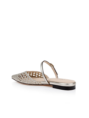 The Jacklyn Leather Flat Mule features a silver woven leather upper, pointed toe, metallic strap, and low black heel, shown on a white background.