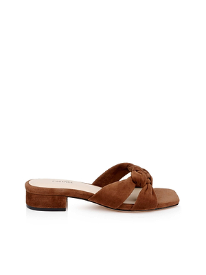 The Lea Suede Knot Sandal features brown suede, a low block heel, a wide braided strap, open toe, and a memory foam cushion insole for both style and comfort. Displayed against a white background.