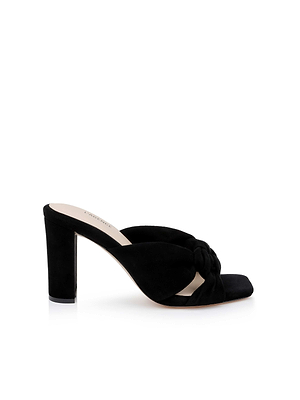 The Leonie Suede Block-Heel Sandal by L’AGENCE Sale is a black suede slip-on with an open toe and thick block heel, featuring a twisted knot front strap, shown on a white background.