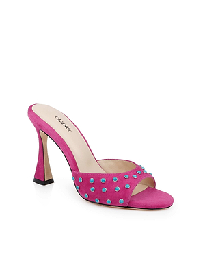 The Lucienne Embellished Suede Mule is a bright magenta open-toe heel sandal with turquoise strap embellishments, a beige insole, and features the L’Agence brand.