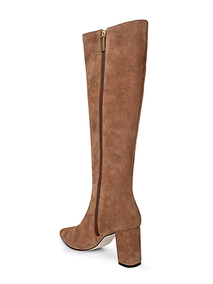 The Octavie Knee-High Boot in tan suede, featuring a side zipper, block heel, and round toe, is displayed from a side view against a white background.