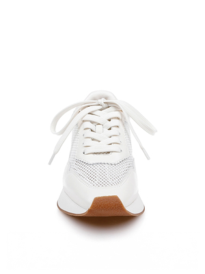The Deepa Platform Sneaker in white features mesh accents, white laces, a mesh upper, and a brown rubber sole, shown from the front against a white background.