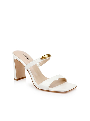 The Catriona Leather Sandal is a white mule featuring two straps, a sculpted block heel, and a gold accent on the upper strap, shown against a white background.