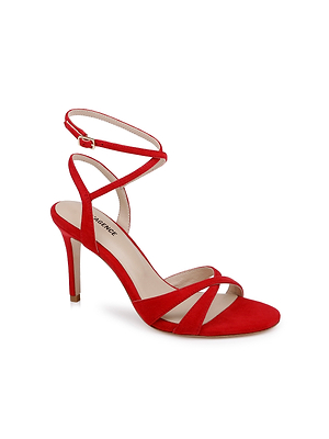 The Miranda Suede Sandal is a red high-heeled shoe with thin crisscross ankle-wrap straps and a buckle closure, ideal as elegant evening footwear, shown on a white background.