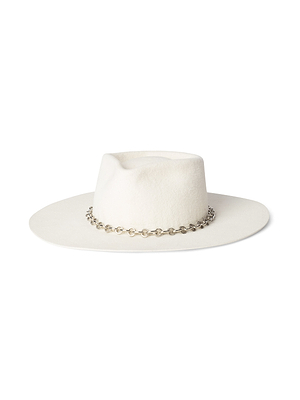 The Umbra Hat is a handcrafted wide brim hat with a flat crown in white felt, elegantly finished with a decorative silver chain around the base.