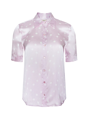 The Ellah Silk Blouse is a short-sleeve, light pink top with white polka dots, featuring a pointed collar and button-down front.