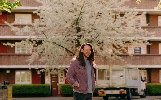 Thomas Delaney in front of a blossoming tree