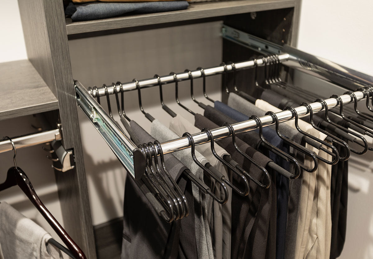 Custom closet system with drawers, shelves, and hanging rods