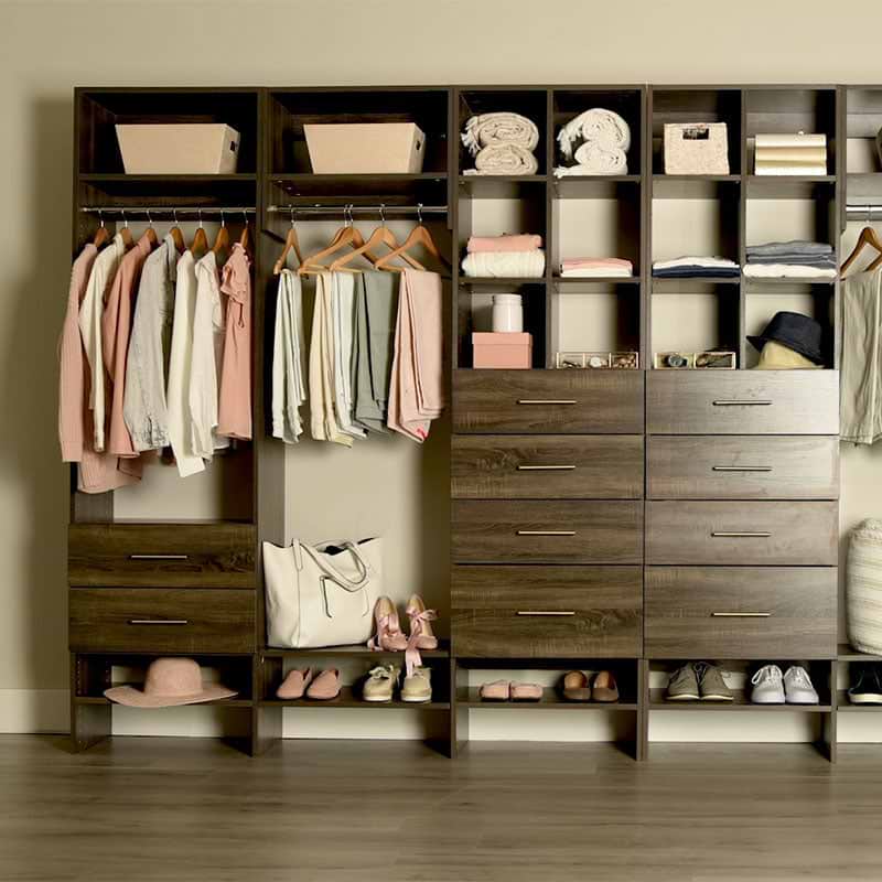 Custom closet system with drawers, shelves, and hanging rods