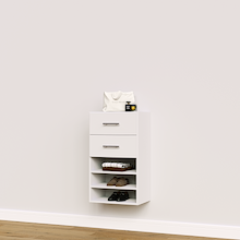 White closet drawer unit with slab fronts and shelves for folded clothes and wardrobe storage.