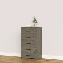 Grey closet drawers with slab fronts for folded clothing, t-shirts, and activewear.