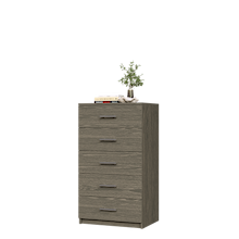Grey closet drawer unit with slab fronts and top surface for jewelry or accessory storage.