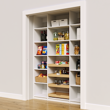 White 60 inch pantry wall shelves featuring four sliding wood drawers.