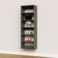 Grey 22.5 inch shelf tower for organizing folded sweaters in a dressing room.