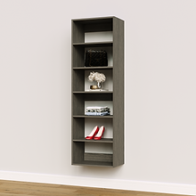 Grey 21 inch wardrobe shelf for maximizing stacked storage in a studio apartment.