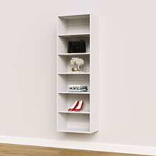 White 21 inch shelf tower for baby essentials in a nursery closet.