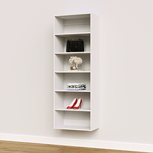 White 24 inch shelving tower for linens and detergent in a laundry room.
