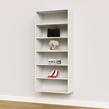 White 30 inch wide closet organizer for folded blankets and linens.