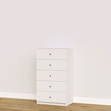 White built-in closet drawers with slab fronts for folded clothing and accessory storage.