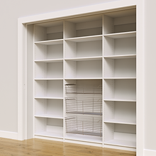 Adjustable shelves with wire baskets in an 87 inch white kitchen pantry.