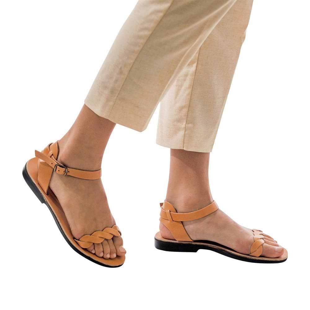 Model wearing Arden tan, handmade leather sandals with back strap  