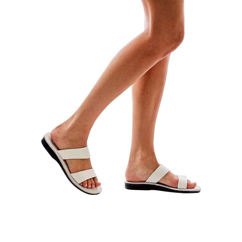 Model wearing Aviv white, handmade leather slide sandals 