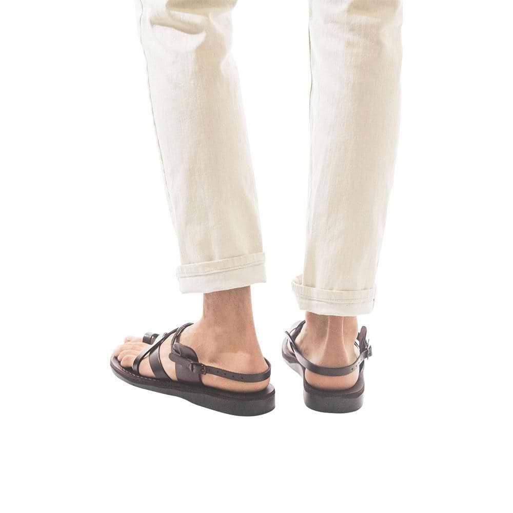 Model wearing The Good Shepherd Buckle brown, handmade leather sandals with back strap and toe loop