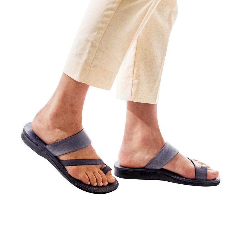 Model wearing Zohar gray, handmade leather slide sandals with toe loop