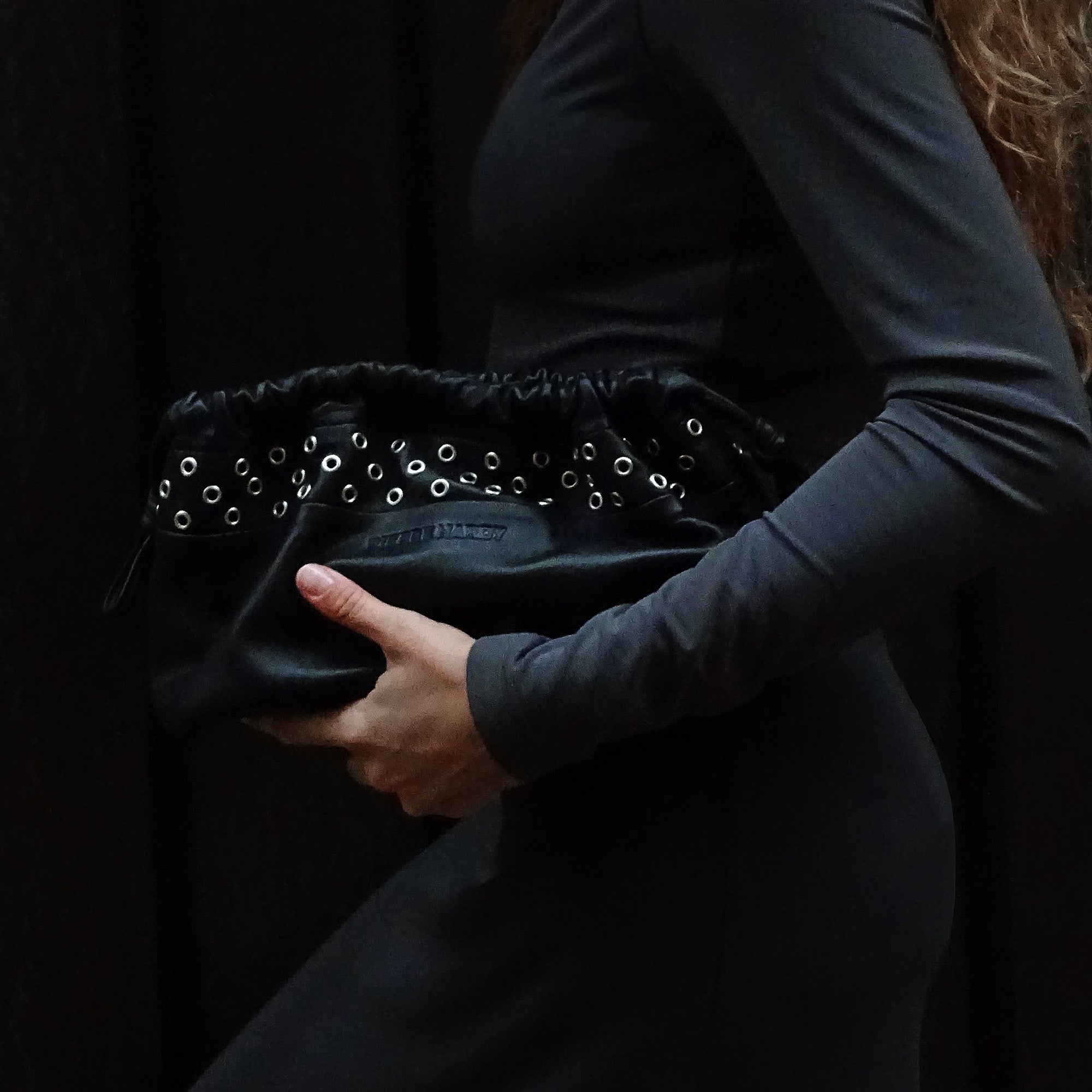 TWIN CLUTCH WITH EYELETS