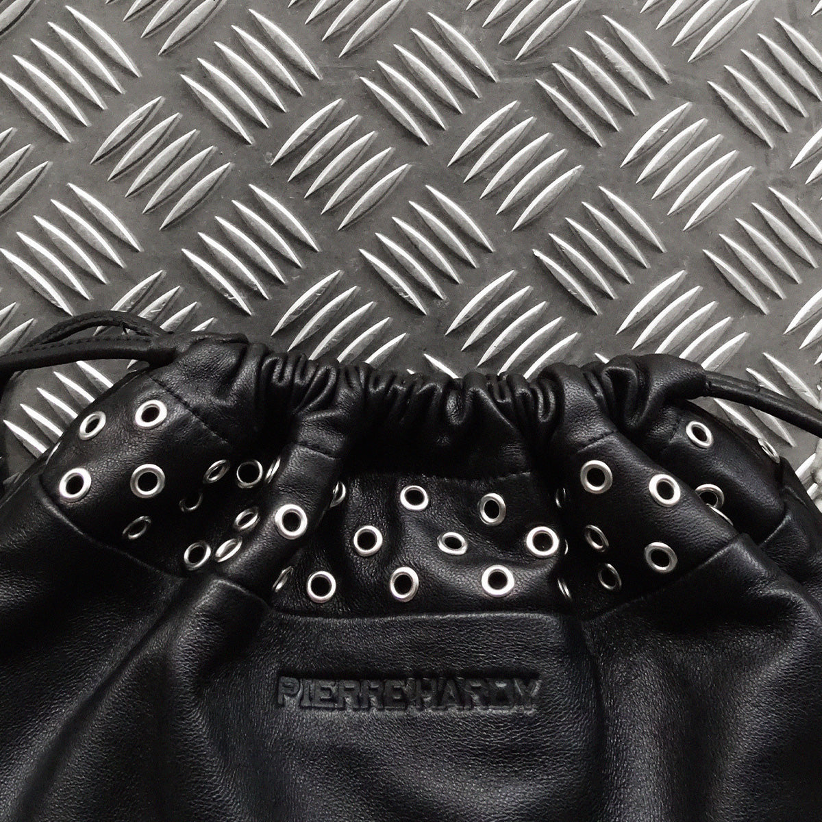 TWIN CLUTCH WITH EYELETS