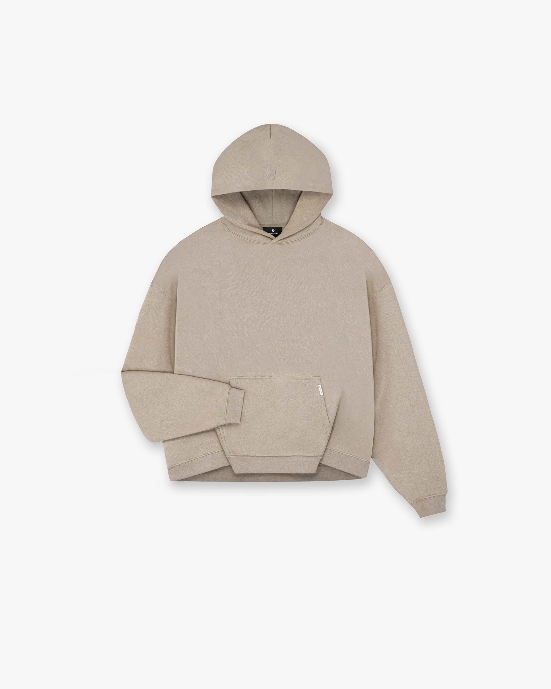 Product image of a mens beige hoodie on a plain white background | Initial Boxy Hoodie in Dune | Boxy fit hoodie with minimalist design | Initial Hoodies | Represent Clo