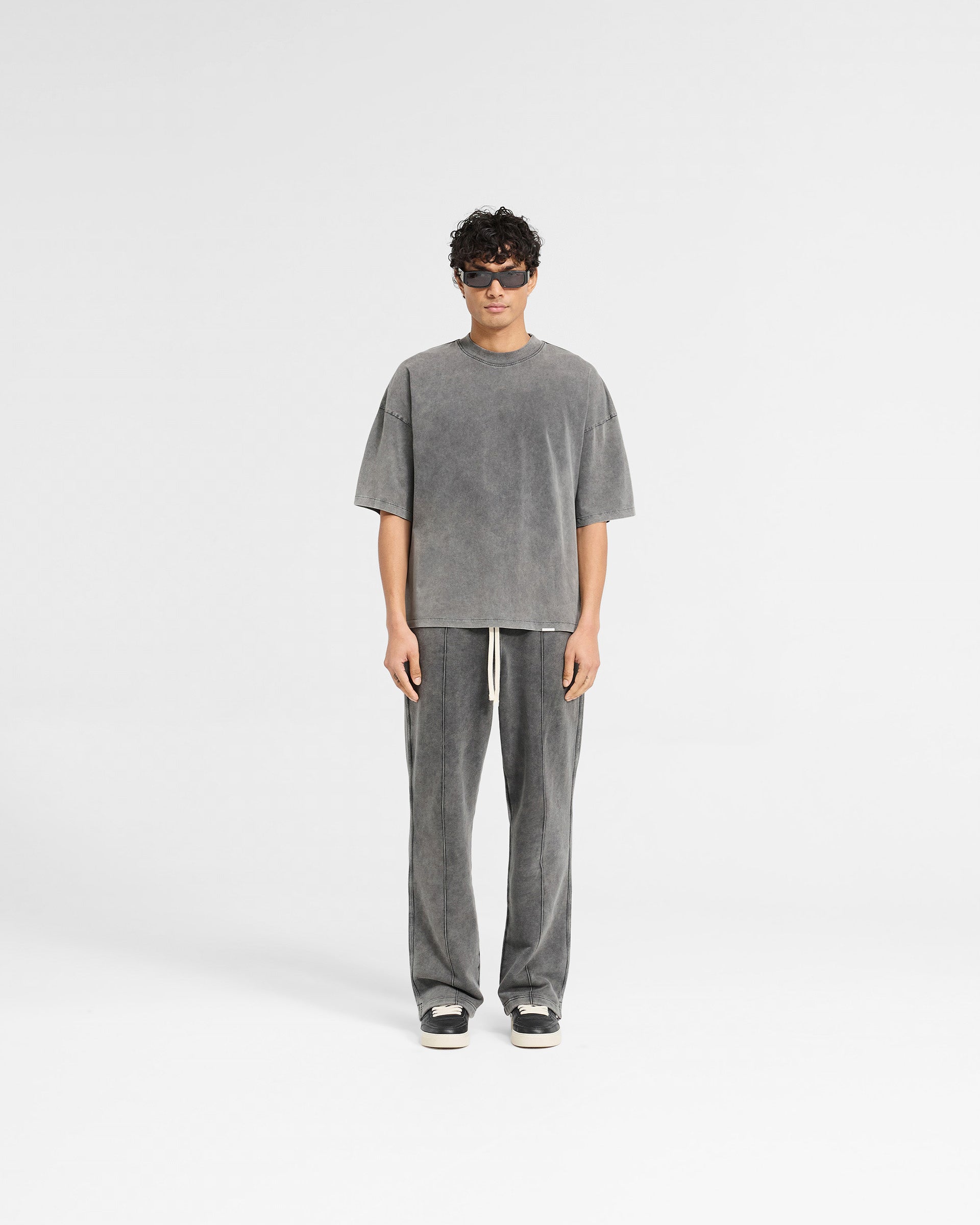 Man wearing a grey boxy t-shirt on a plain white background | Initial Boxy T-Shirt in Vintage Grey | Super oversized cropped t-shirt | Initial T-Shirts | Represent Clo