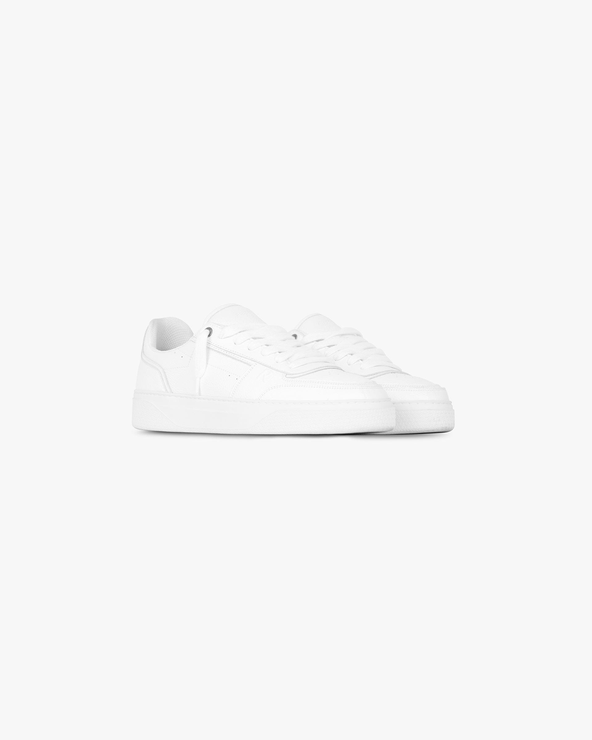 Back product image of mens white leather sneakers on a plain white background | Initial Sneaker in Flat White | Leather sneakers with perforated toe and rubber midsole | FW24 Footwear | Represent Clo