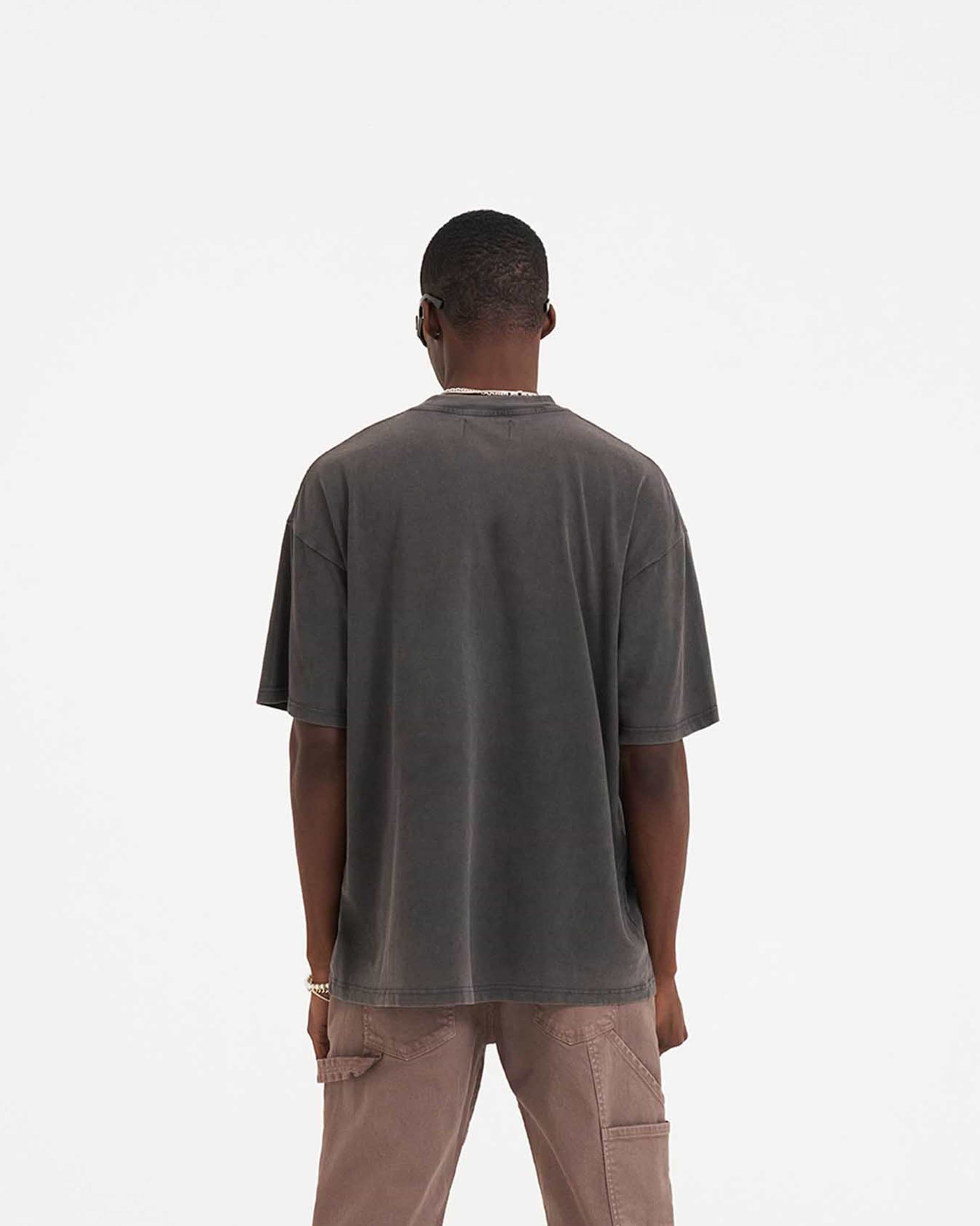 Man wearing a grey graphic t-shirt on a plain white background | Shark Jaws T-Shirt in Vintage Grey | Oversized fit short sleeve t-shirt with screen printed graphic | SS23 T-Shirts | Represent Clo