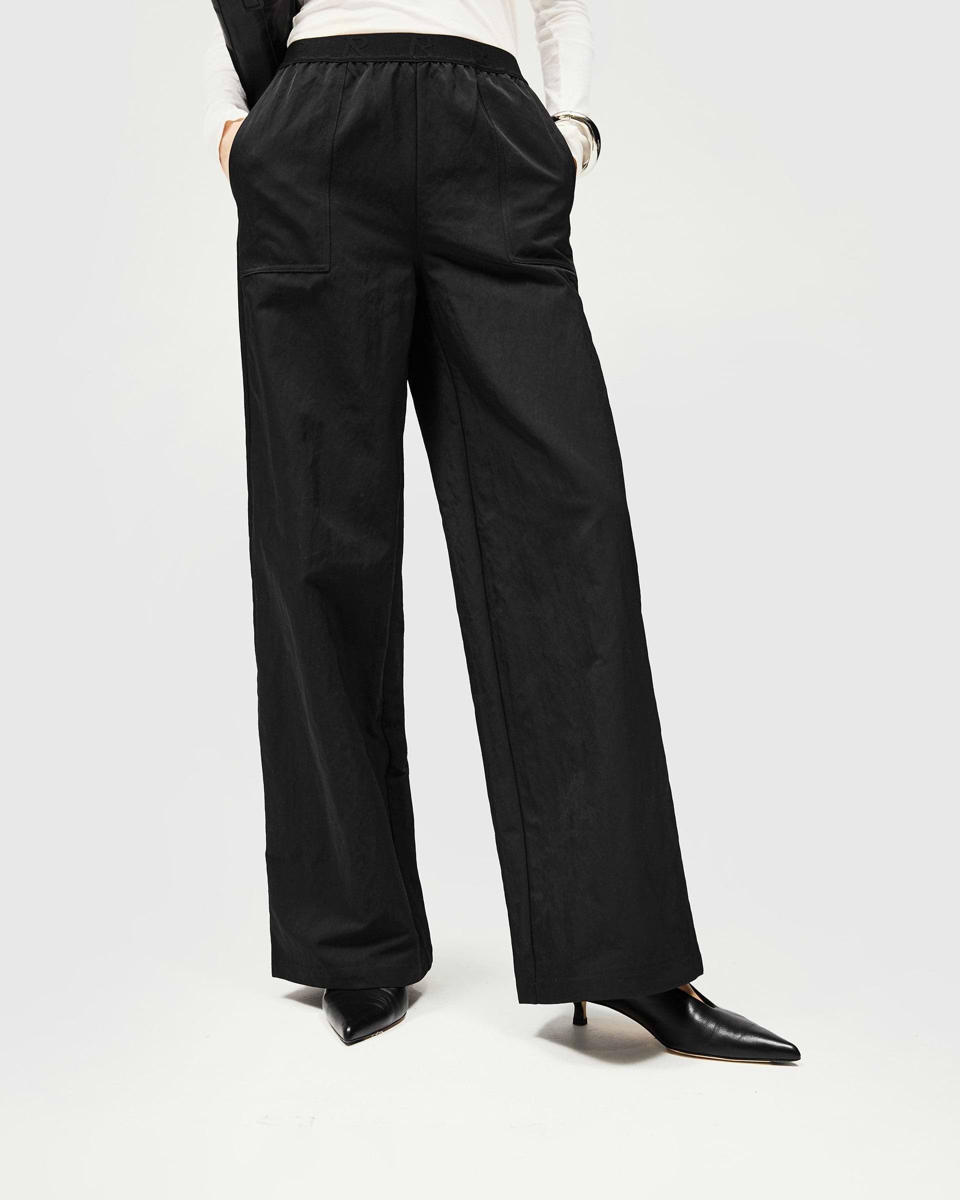 Back product image of a womens black jogger on a plain white background | Subway Jogger in Jet Black | Nylon jogger with crinkle texture and R Initial elastic waistband | SS25 Bottoms | Represent Clo