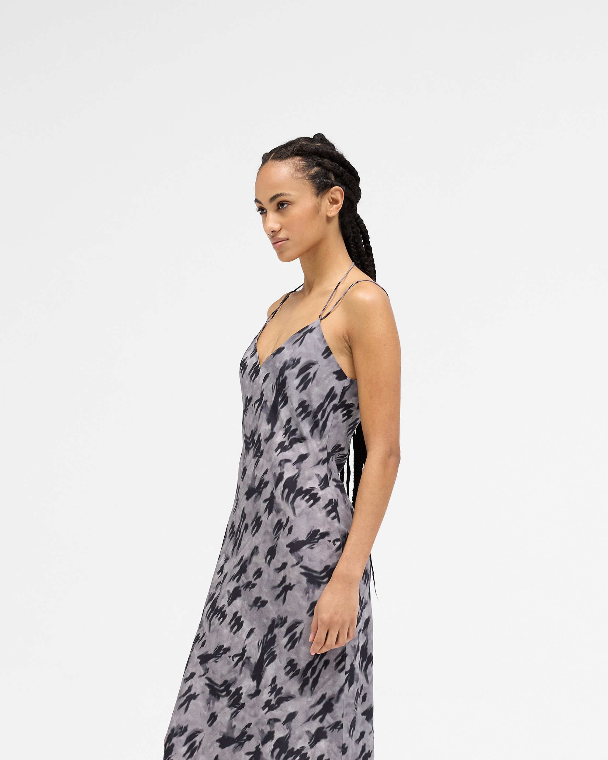 Back product image of a womens dark print dress on a plain white background | Street Shadow Dress in Dark Scenic Print | Slip dress with adjustable straps and thigh split | Womens SS25 Dresses | Represent Clo