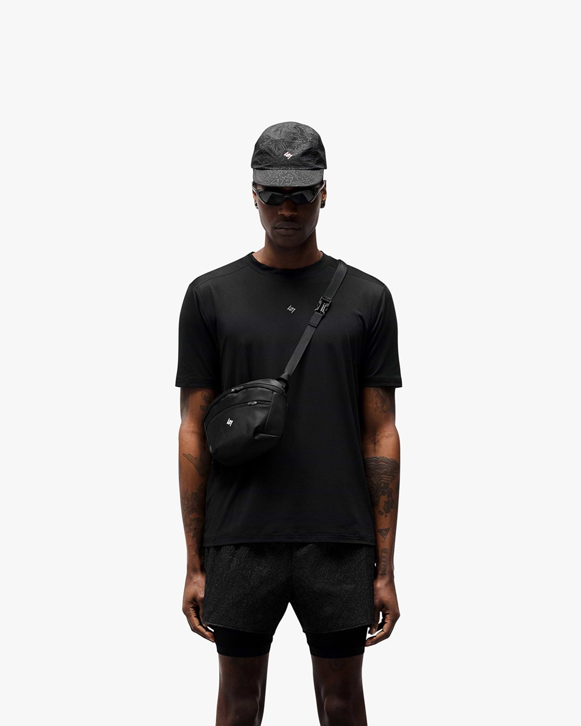 Man wearing a black t-shirt on a plain white background | 247 Contour Run T-Shirt in Black | Breathable and sweat-wicking running t-shirt | 247 T-Shirts | Represent Clo