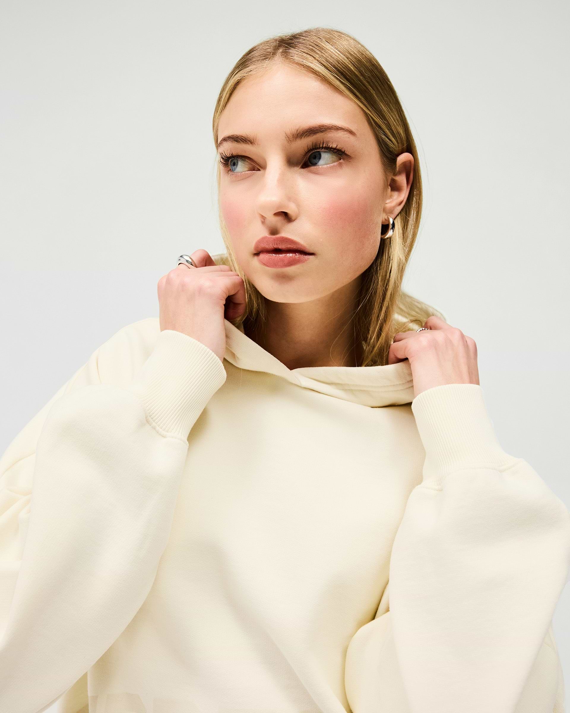 Back product image of a womens cream hoodie on a plain white background | Boyfriend Graphic Hoodie in Cream | Oversized hoodie with ribbed hem and cuffs | Womens SS25 Hoodies | Represent Clo