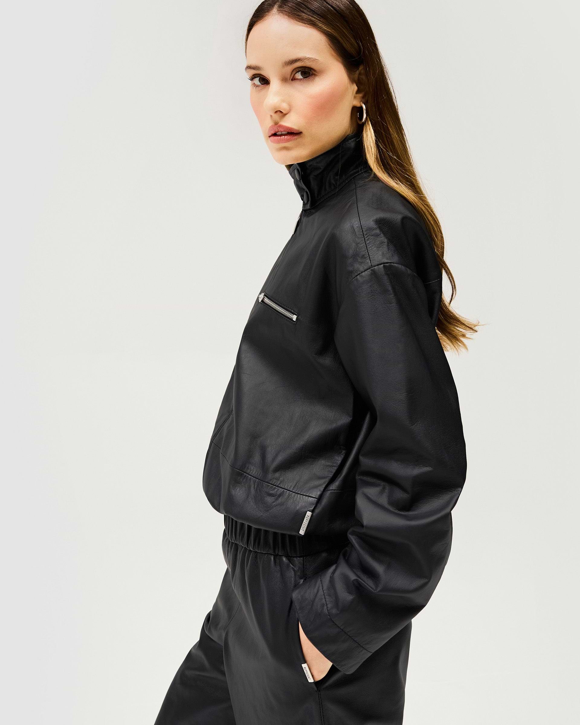 Back product image of a womens black leather jacket on a plain white background | Fuel Jacket in Jet Black | Leather jacket with elasticated gathered hem and 2 way zip | Womens SS25 Outerwear | Represent Clo