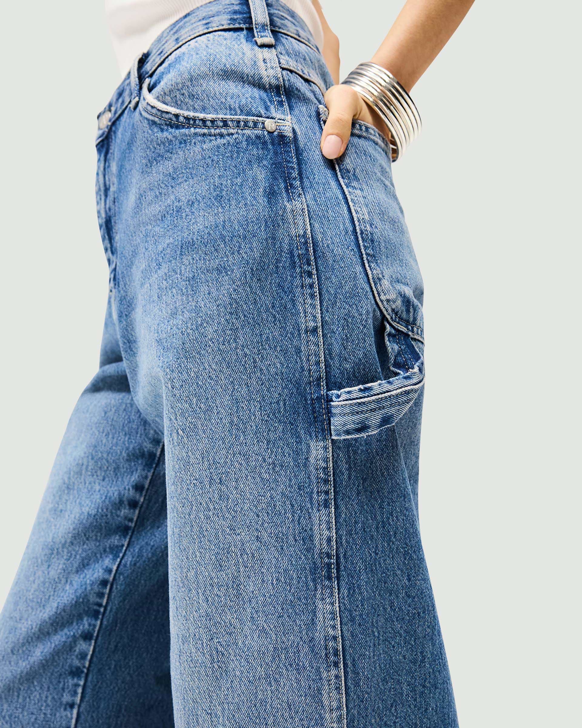 Back product image of womens blue jeans on a plain white background | Skater Jean in Washed Blue | Oversized skater jeans with low rise and skater back pockets | Womens SS25 Jeans | Represent Clo