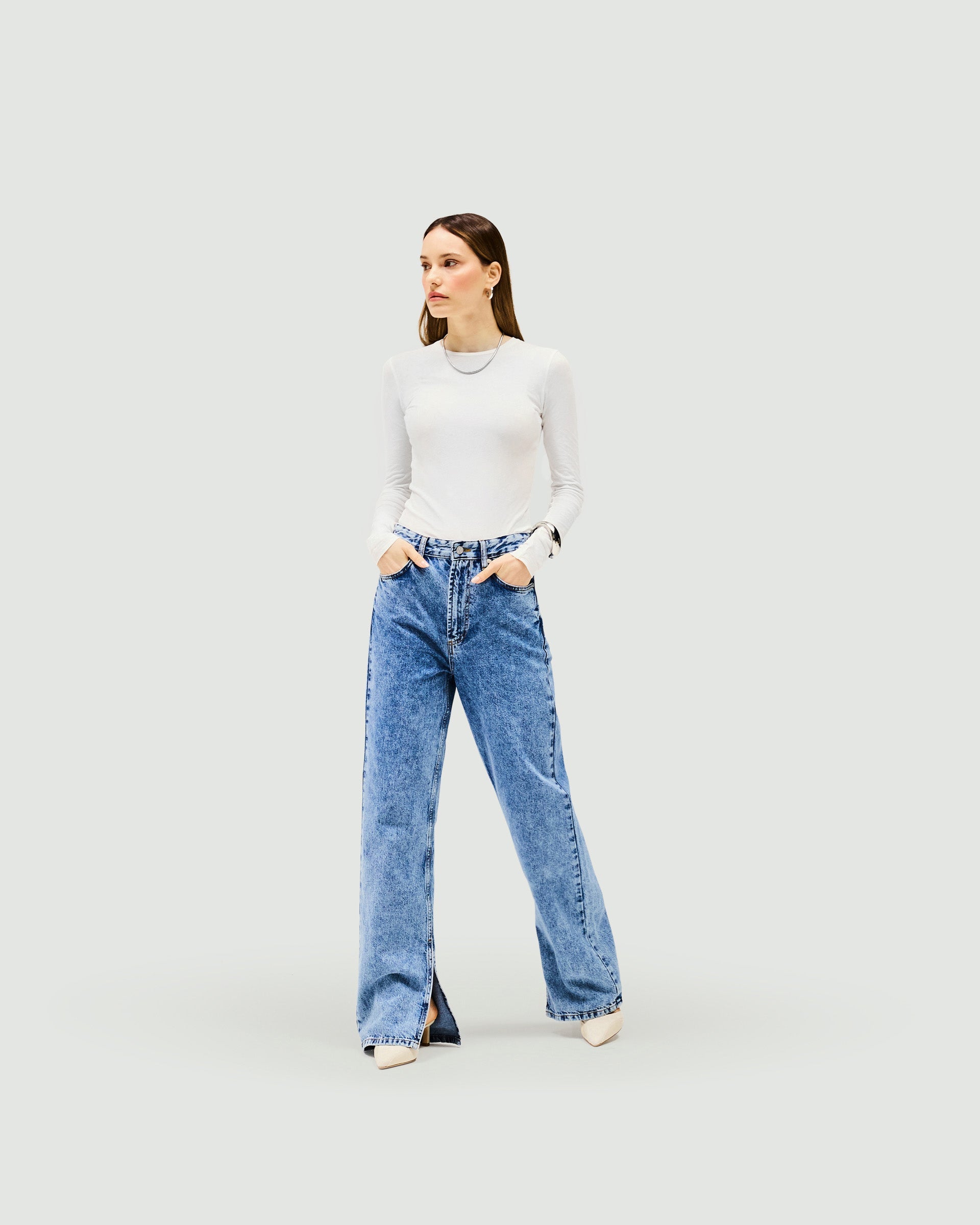 Back product image of womens blue jeans on a plain white background | Split Hem Straight Jean in Washed Blue | Straight leg jeans with outside seam split | Womens SS25 Jeans | Represent Clo