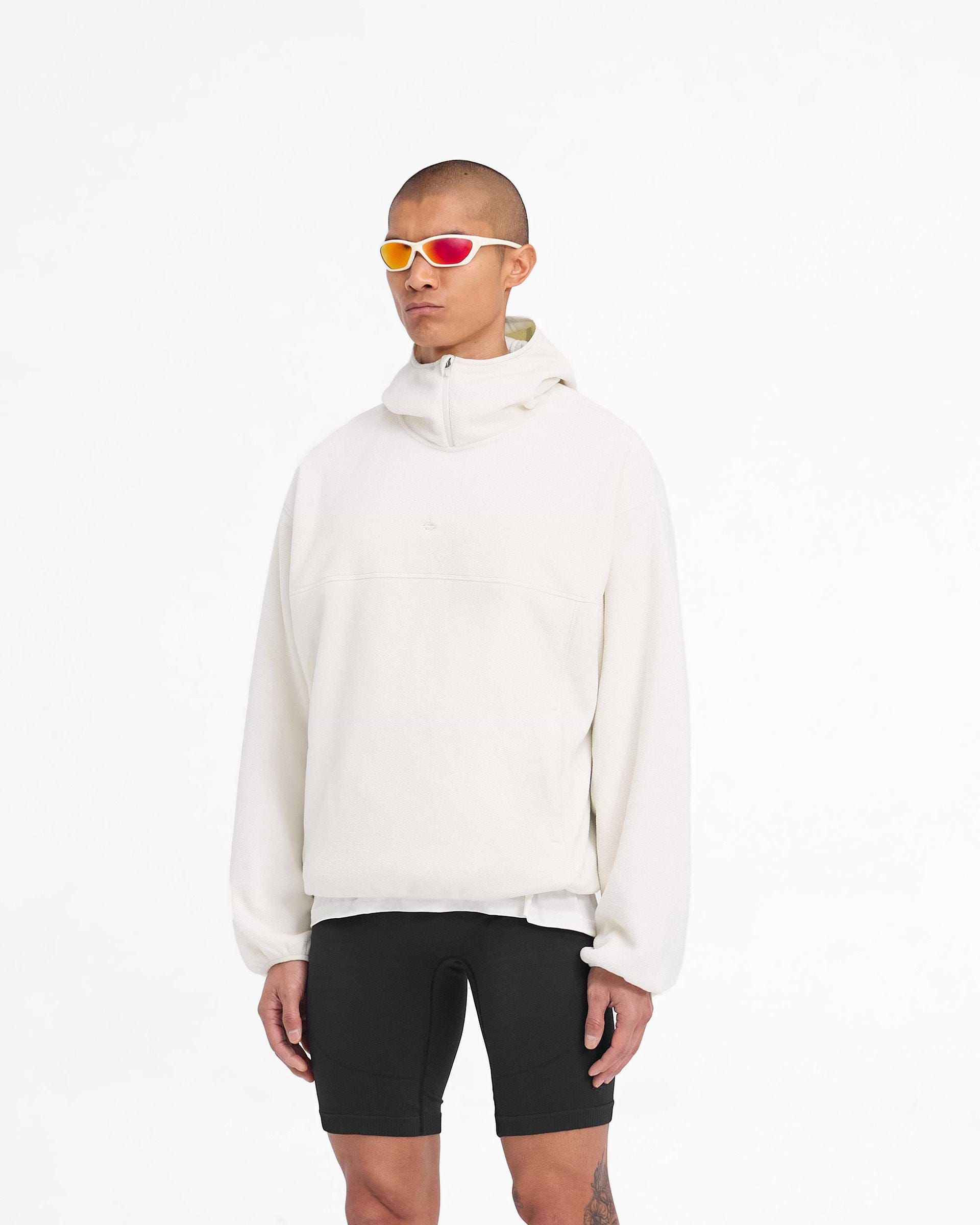 Man wearing an oversized fleece hoodie in white on a plain white background | 247 Fleece Hoodie in Papyrus | Oversized boxy fit fleece hoodie with zip pockets | 247 Hoodies | Represent Clo