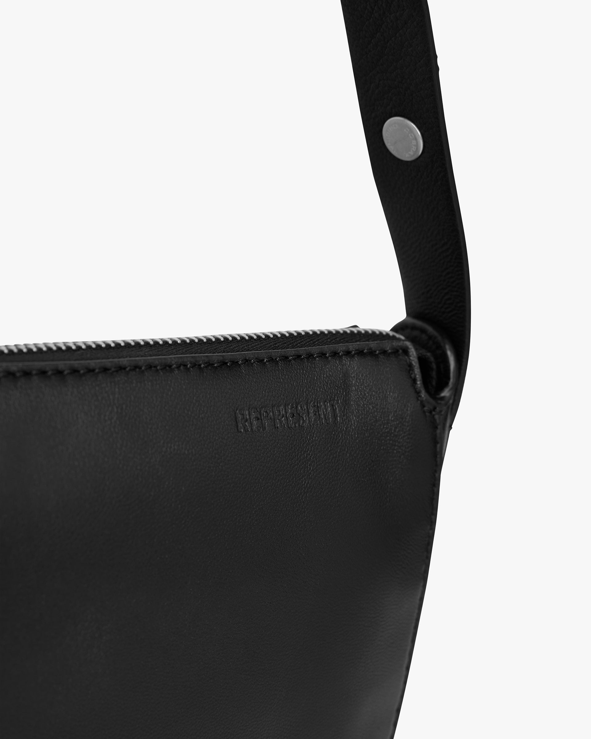Back product image of a womens black leather saddle bag on a plain white background | Saddle Bag in Black | Zip closure adjustable shoulder strap | Womens SS25 Accessories | Represent Clo